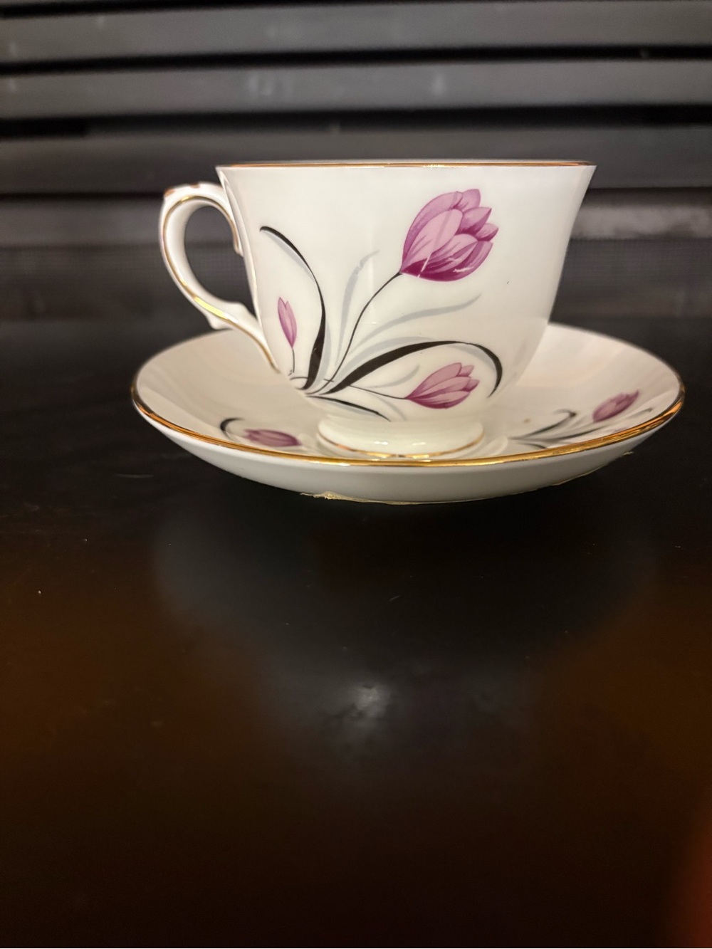 White Porcelain Teacup and Saucer with Pink Floral Accent